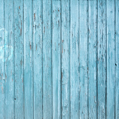 wooden structure with blue peeling old grungy paint
