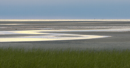 Creative abstract coastal scene of tidal flats at low tide