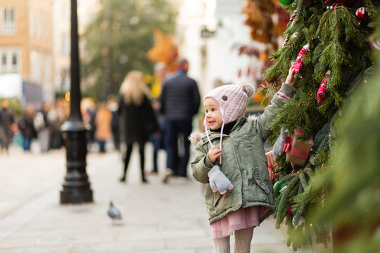 Little Girl At Christmas Market In Covent Garden In London