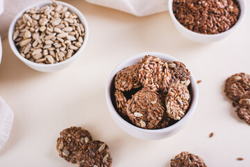 Homemade crispbread made from flax and sunflower seeds in a bowl on the table