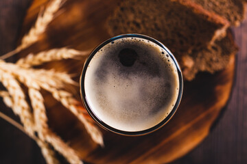 Close up of kvass traditional drink made from fermented bread in a glass on the table top view - obrazy, fototapety, plakaty