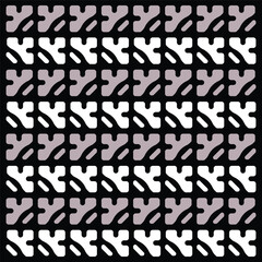 A mesmerizing black and white pattern against a dark backdrop