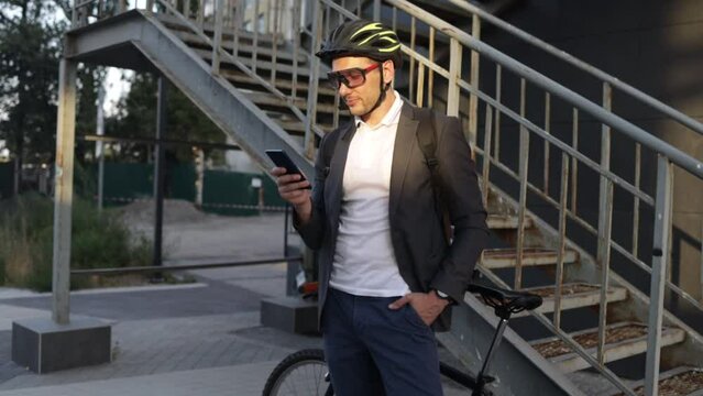 Phone typing, bicycle and happy man, city agent or consultant texting, scroll and reading business notification. Cycling, transportation bike and person search website during morning travel commute