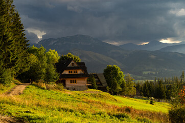 Beautiful country view with mountains in the background. View of the Tatra Mountains and Koscielisko Village in Poland.