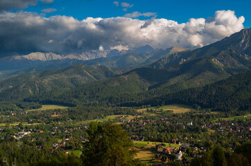 Fototapeta na wymiar Beautiful view with mountains in the background. View of the Tatra. Zakopane. Poland.