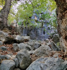 Pinara ruins of an ancient city near Fethiye, Mugla, Türkiye. Lycian tombs, ancient Roman amphitheater and mountains.