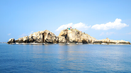 Fototapeta na wymiar Rocks in the sea. The South China Sea. Swallow Island.