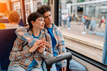 couple hugging on a bus, tram Lifestyle concept - obrazy, fototapety, plakaty