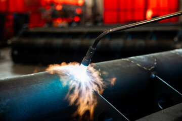 Heating up of metal construction with acetylene and oxygen burner in process of flame straightening...
