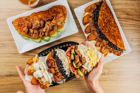 Venezuelan food on a table, arepas, tostones, cachapas, empanadas. typical Venezuelan gastronomy