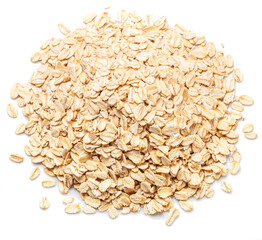 Rolled oats or oats flakes heap isolated on white background. Top view.