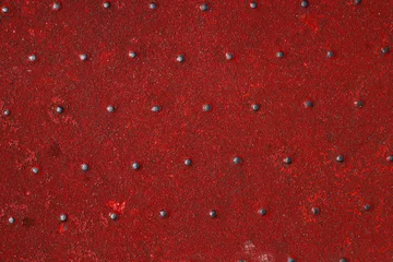 Fototapete Grunge steel industrial boat floor plate painted dark vivid red anti-rust paint. Robust ferry ship metal pattern. Old dotted iron deck. Worn metal texture background. Modern design concept. Copy space © Dina