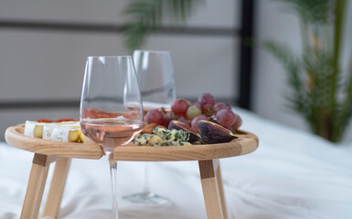 To celebrate a holiday. Wine table with snacks and wine