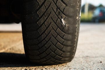 The nail hit a car tire. Car service. Tire service