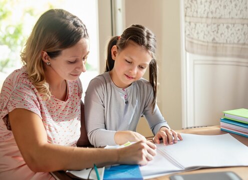 REAL PHOTO OF A FAIR-SKINNED MOTHER, HELPING HER DAUGHTER WITH HOMEWORK, IN A SUNNY ROOM GENERATED BY AI GENERATIVE