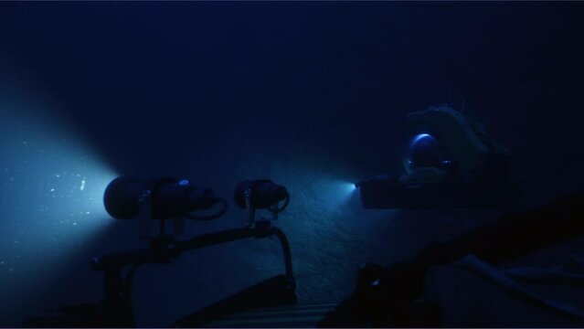 Medium Shot Of Submarine Lights In Ocean Depths