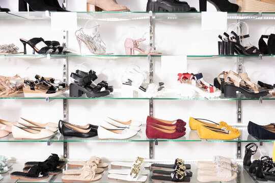 In shop window number of women shoes of various brands with affordable price.Peep toe, escarpins, moccasins, slingback, t-strap, ankle strap shoes, kitten heels, sandals, flip flop, platform on shelf