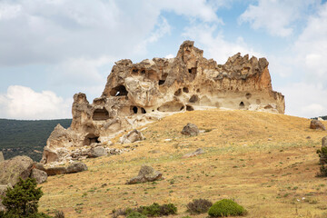 Historical ancient Frig (Phrygia, Gordion) Valley. Tomb (shrine, turbe) and old cemetery. Frig Valley is popular tourist attraction in the Yazilikaya, Afyon - Turkey.