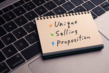 There is notebook with the word Unique Selling Proposition. It is as an eye-catching image.