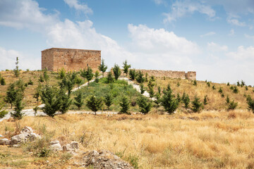 Fototapeta na wymiar Historical ancient Frig (Phrygia, Gordion) Valley. Tomb (shrine, turbe) and old cemetery. Frig Valley is popular tourist attraction in the Yazilikaya, Afyon - Turkey.