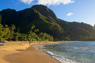 Taking a sunset dip at Tunnels and Ha'ena Beaches, located at the end of Kuhio Highway in Kauai, Hawaii.