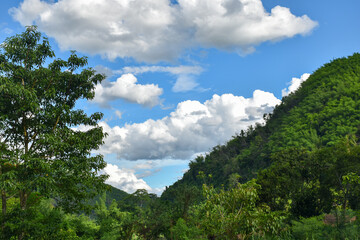 Fototapeta na wymiar Mountains and sky, hills in Thailand, landscape for banner 