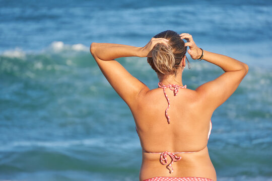 Blonde, Fair-Skinned Plus Size Woman Contemplating Sunset on Beach