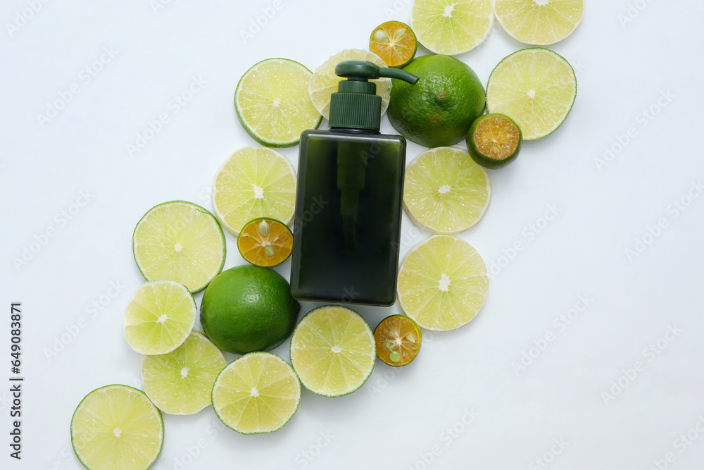 Sticker On the white background, pump bottle is placed on many kumquat and lime slices. Lime and Kumquat can also be used to flavor drinks and dishes