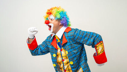 Mr Clown. Portrait of Funny face Clown man in colorful uniform standing variety action. Happy expression male bozo in various pose on isolated background. - obrazy, fototapety, plakaty
