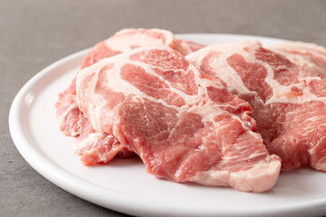 fresh pork neck on plate