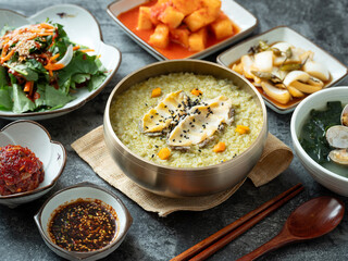 Abalone porridge, clam seaweed soup, and various side dishes