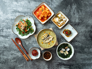 Abalone porridge, clam seaweed soup, and various side dishes	