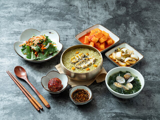 Abalone porridge, clam seaweed soup, and various side dishes	
