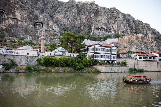 Amasya,TURKEY old riverside Turkish(ottoman) city buildings and its reflection on water,sunny summer day.Amasya is city of princes of ottoman. ottoman Princes were educated in Amasya