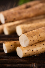fresh Chinese yam on wooden table.