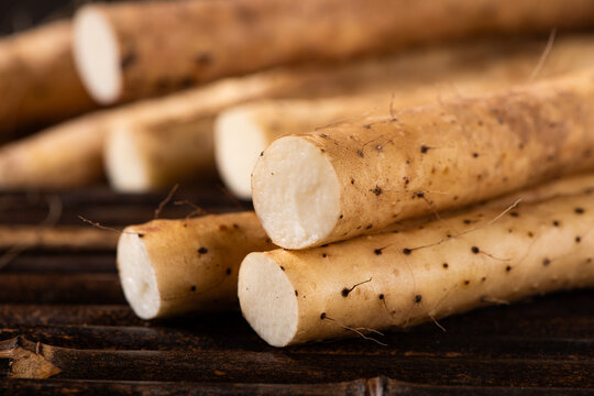 fresh Chinese yam on wooden table.