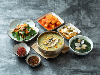 Abalone porridge, clam seaweed soup, and various side dishes