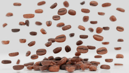 Coffee beans falling on white background closeup