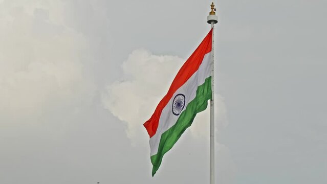 indian flag swaying and clouds in the background daytime 4k 25p
