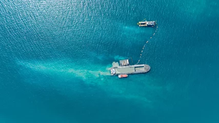Foto op Plexiglas Aerial top view of Vessel engaged in dredging. Hopper dredger working at sea. Ship excavating material from a water © Yellow Boat