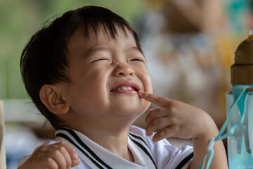 Close-up Portrait image of Happy 1-2 years old Asian Chinese child on happy mode