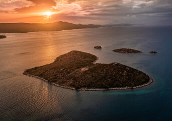 Galesnjak, Croatia - Aerial view of the beautiful heart-shaped island Galesnjak with a colorful dramatic summer sunset above the Adriatic mediterranean sea at the Dalmatia region