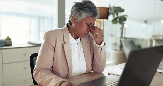 Business woman, burnout and headache at laptop for anxiety, vertigo and crisis of debt, 404 glitch and bad mistake. Frustrated mature entrepreneur at computer with stress, fatigue and tech challenge