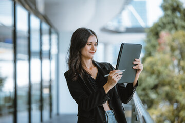 Millennial digital nomads work remotely, using laptops to connect , create content on the move.