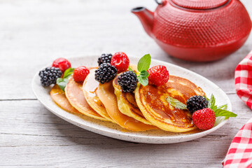 Tasty homemade pancakes with berries