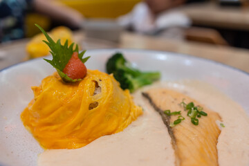 An exquisite serving of Eggs Benedict, where the harmony of poached eggs, luscious hollandaise sauce, and toasted bread creates a delectable masterpiece ready to be savored.