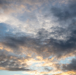 Naklejka na ściany i meble Clouds after rain at sunset. Background