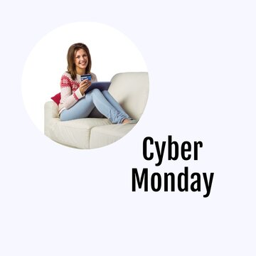Cyber monday text with happy caucasian woman sitting on couch using tablet and credit card online
