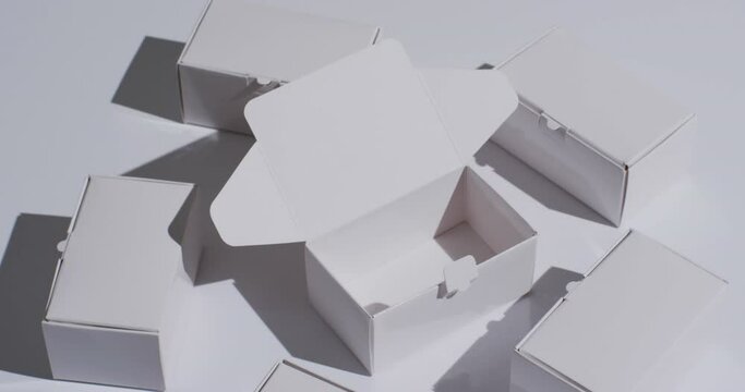 Video of cardboard boxes with copy space over white background