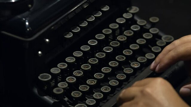 Hands Of A Writer Typing On Antique Typewriter. Close Up